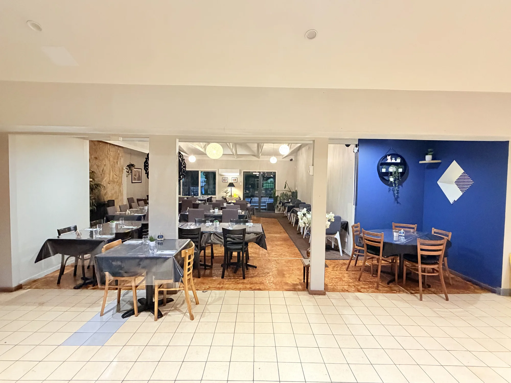 Restaurant interior lighting and tables at TASSIE FLAME